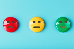 Botões de feedback com carinhas para pesquisa de satisfação: triste, neutro e feliz.